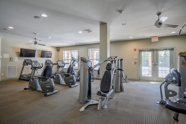 workout area featuring ceiling fan, a healthy amount of sunlight, light carpet, and french doors