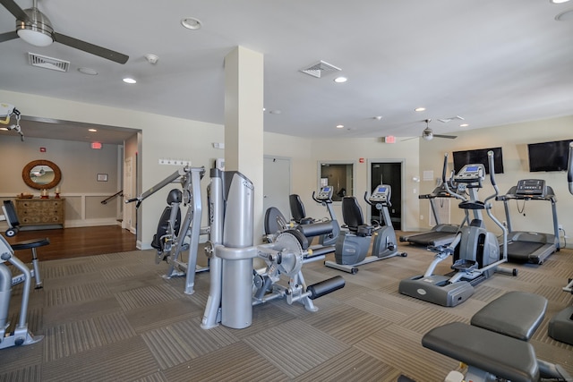 exercise room featuring ceiling fan and carpet