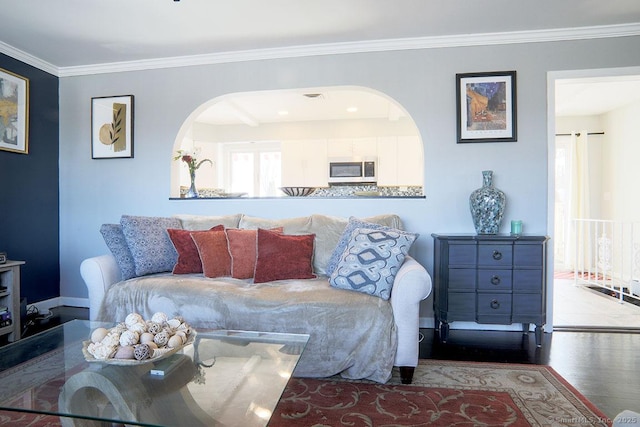 living room featuring light hardwood / wood-style flooring and crown molding