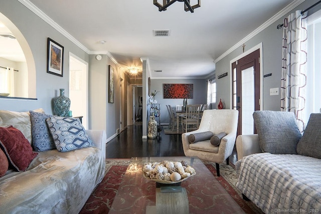 living room with crown molding and dark hardwood / wood-style floors