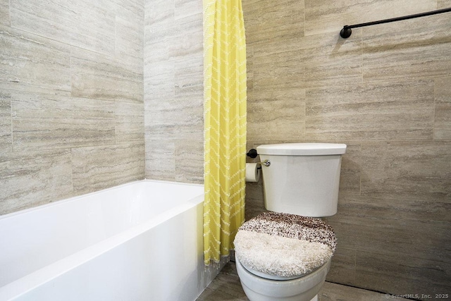 bathroom with toilet and shower / bathtub combination with curtain