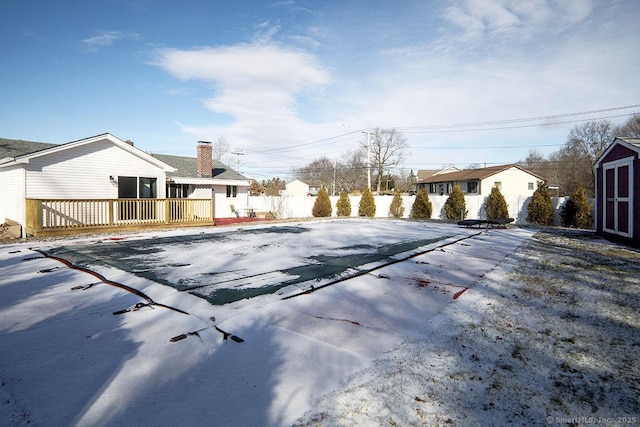 view of swimming pool with a wooden deck