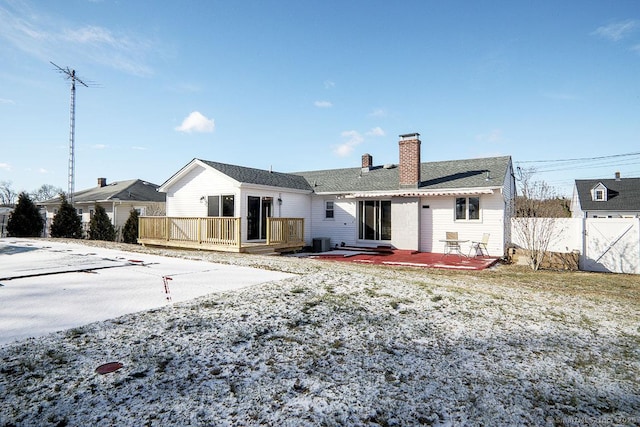 back of property featuring a deck and central air condition unit