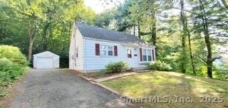 view of front of home with an outdoor structure