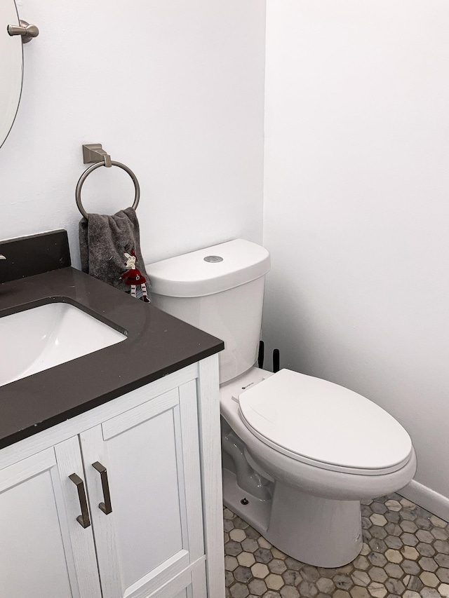 bathroom featuring vanity and toilet