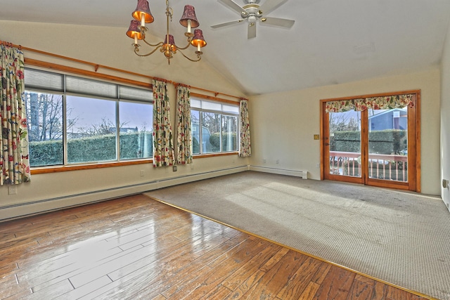 empty room featuring ceiling fan with notable chandelier, wood-type flooring, a baseboard radiator, and vaulted ceiling