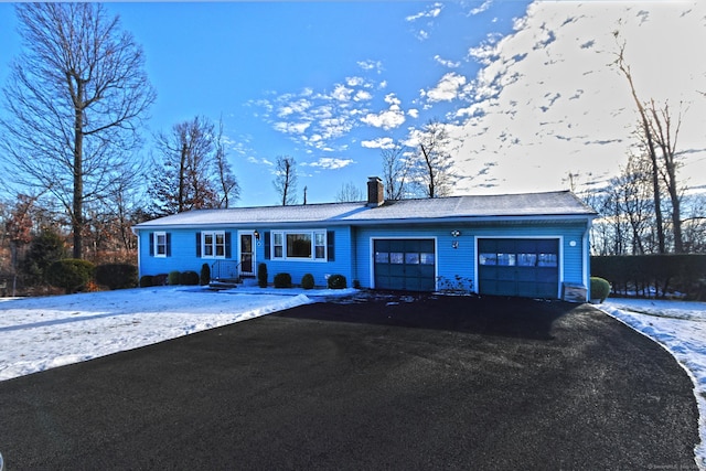 single story home with a garage