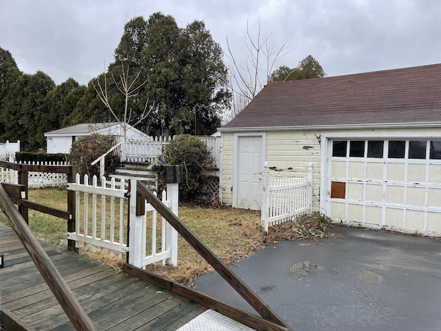 exterior space featuring an outbuilding and a garage