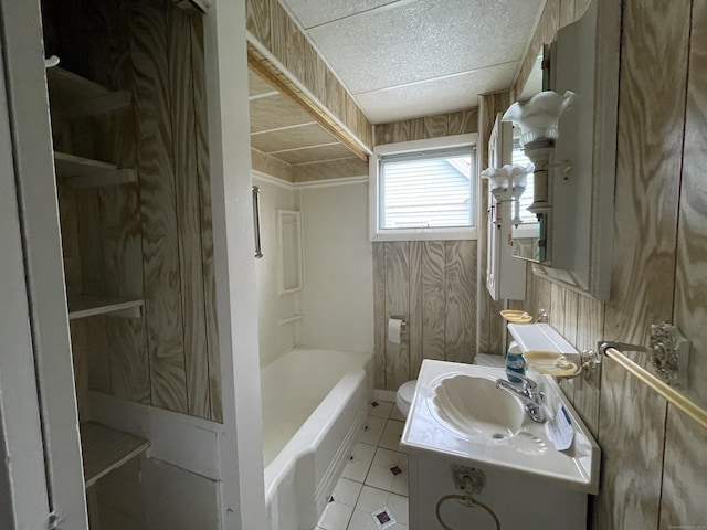 bathroom with tile patterned flooring, vanity, and toilet