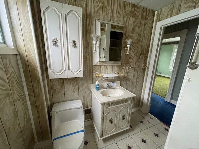 bathroom with tile patterned floors, vanity, and toilet