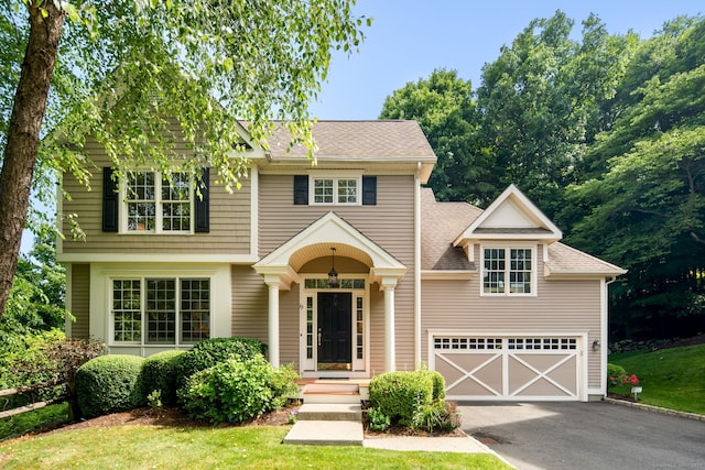 view of front of property with a garage