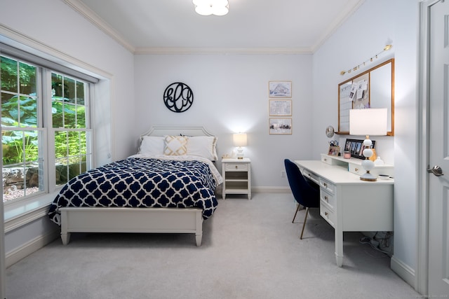 carpeted bedroom featuring ornamental molding