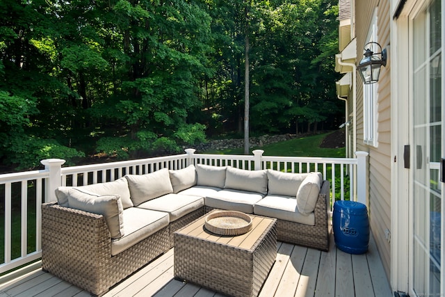 wooden terrace featuring an outdoor hangout area