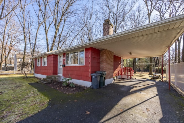 view of front facade with a carport