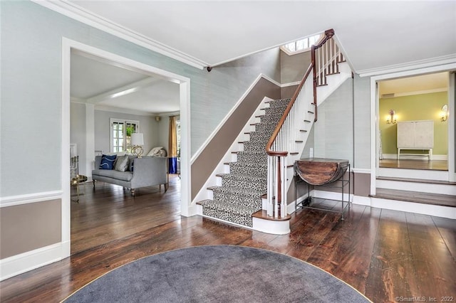 staircase with hardwood / wood-style floors and crown molding