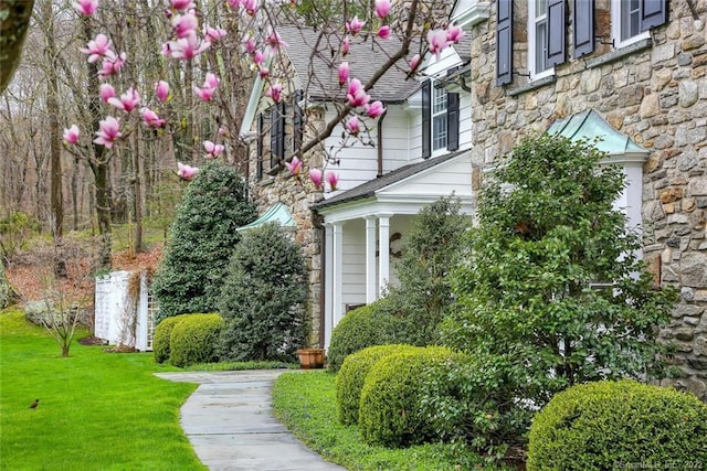 entrance to property with a yard