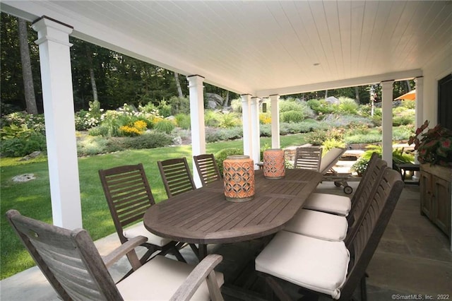 sunroom / solarium with ornate columns and wood ceiling