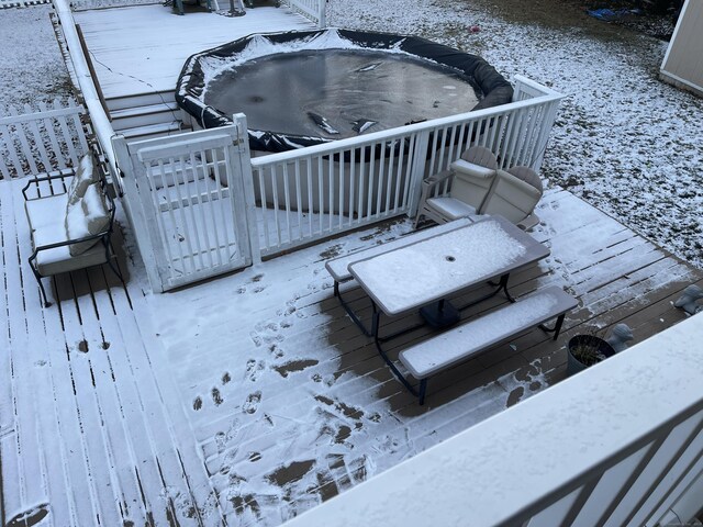 view of snow covered deck