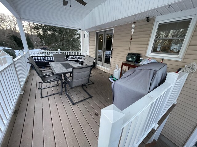 wooden deck featuring ceiling fan