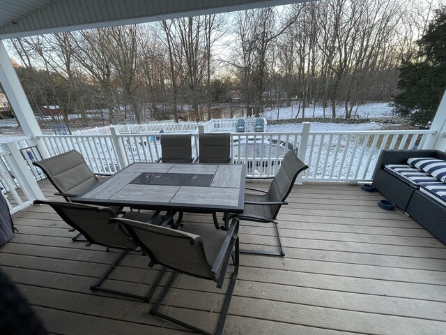 view of snow covered deck