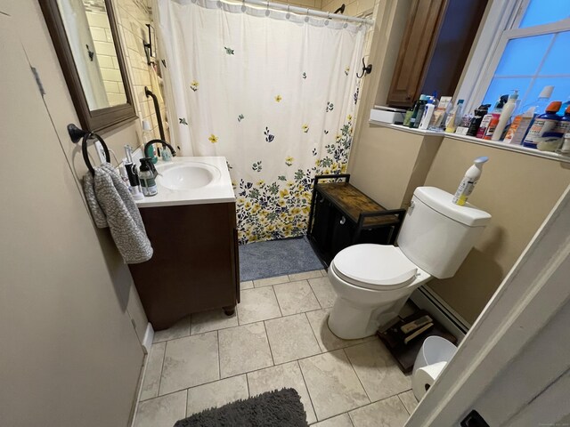 bathroom with vanity, a shower with shower curtain, tile patterned floors, and toilet