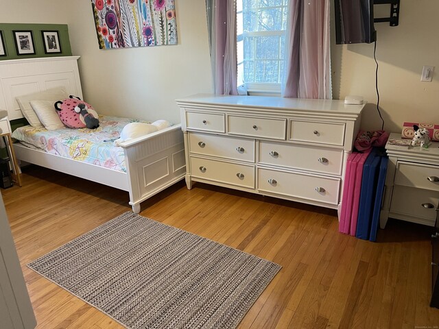 bedroom with light hardwood / wood-style floors