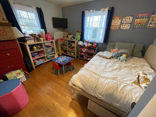 bedroom featuring light wood-type flooring