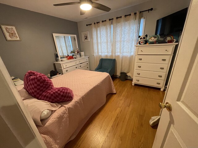 bedroom featuring ceiling fan and light hardwood / wood-style floors