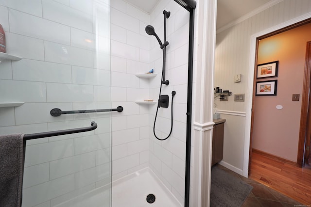 bathroom with a shower with door, tile patterned flooring, and ornamental molding