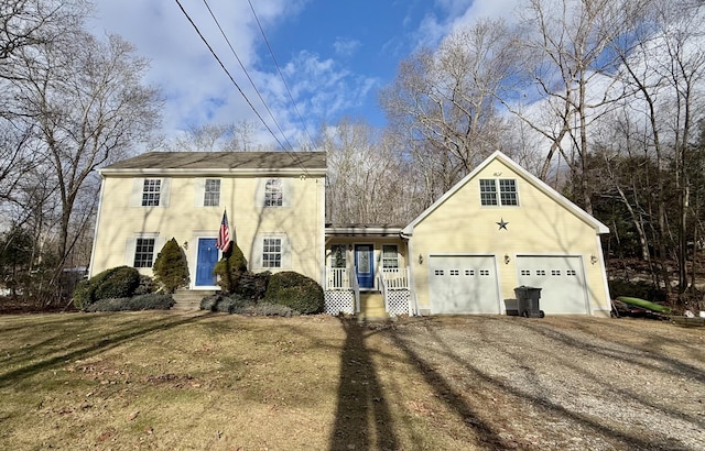 view of front facade featuring a front yard and a garage