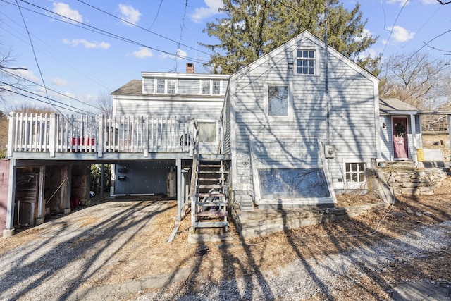 view of front of property featuring a wooden deck