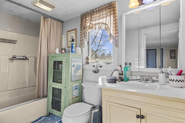 full bathroom featuring vanity, toilet, a textured ceiling, and shower / tub combo with curtain