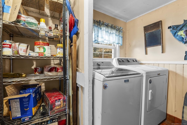 clothes washing area with independent washer and dryer