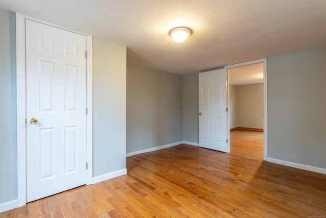 unfurnished bedroom featuring light wood-type flooring