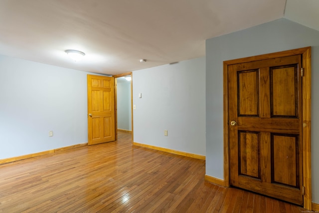 unfurnished room with light hardwood / wood-style floors