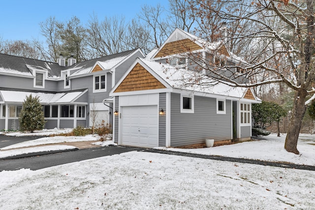 view of snow covered garage