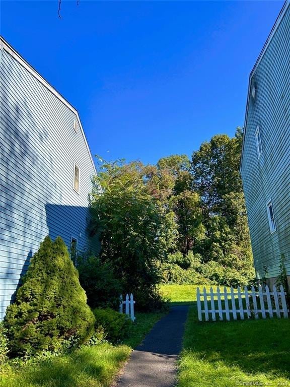 view of side of home featuring a yard