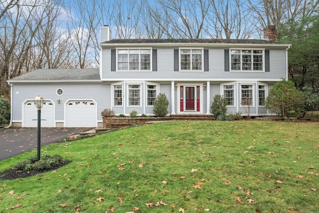 view of front facade featuring a garage and a front yard