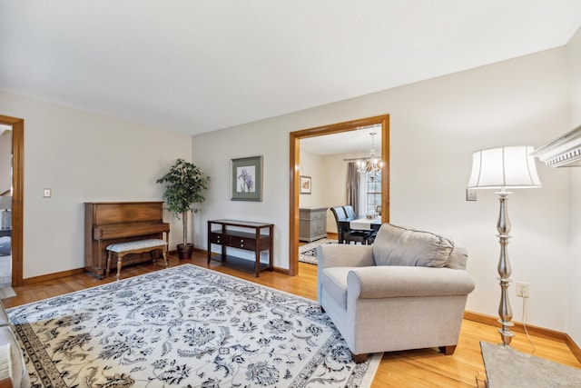 living room with a chandelier and hardwood / wood-style flooring