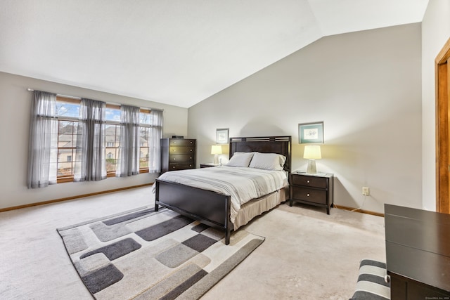 bedroom with light carpet and vaulted ceiling