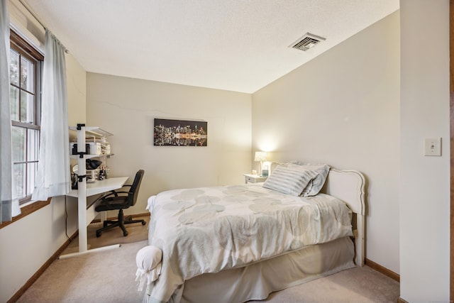 bedroom featuring light colored carpet