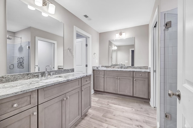 bathroom featuring vanity and walk in shower