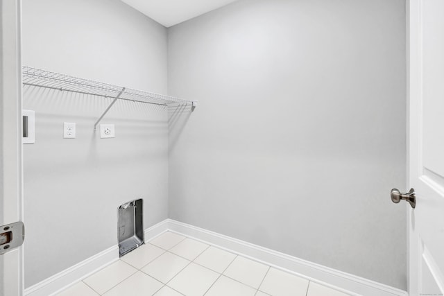 washroom featuring light tile patterned floors and hookup for an electric dryer