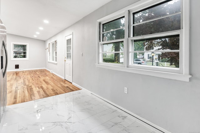 entrance foyer with vaulted ceiling