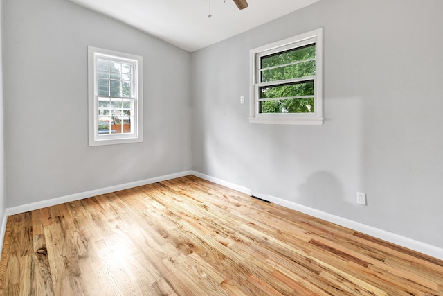 unfurnished room with light hardwood / wood-style floors, ceiling fan, and lofted ceiling