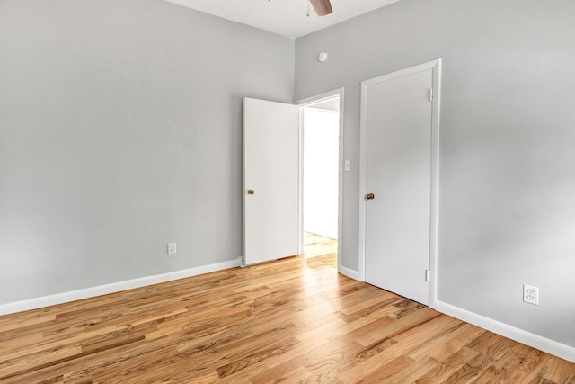 unfurnished room featuring ceiling fan and light wood-type flooring