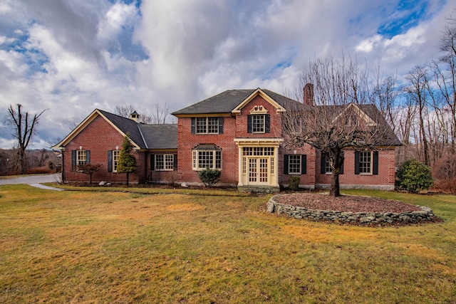 view of front facade featuring french doors and a front yard