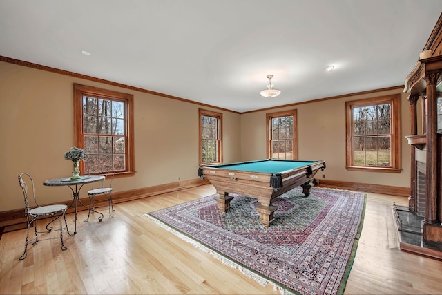 playroom featuring ornamental molding, light wood-type flooring, and billiards