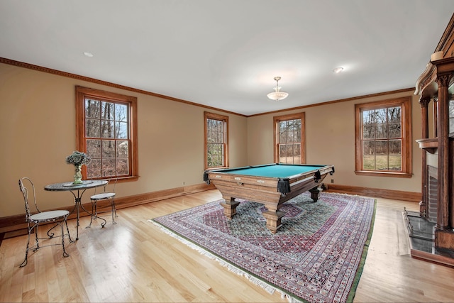 recreation room featuring baseboards, crown molding, wood finished floors, and pool table
