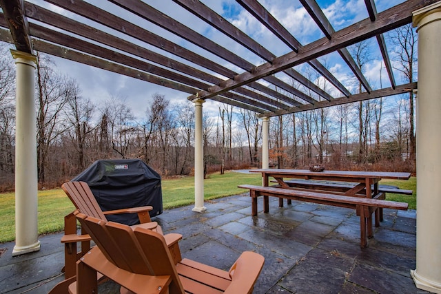 view of patio / terrace with grilling area and a pergola